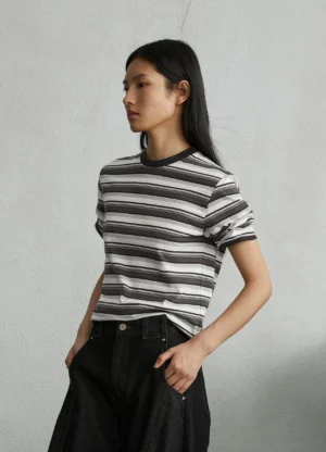 Black off-white and grey striped unisex streetwear T-shirt three-quarter side view on female model