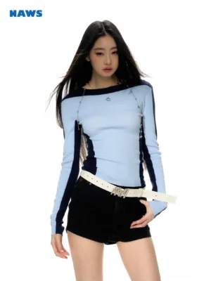 Moonlight Blue striped shoulder fitted crop sweater with light blue knit body, navy trim, cropped silhouette, and shoulder chain detail