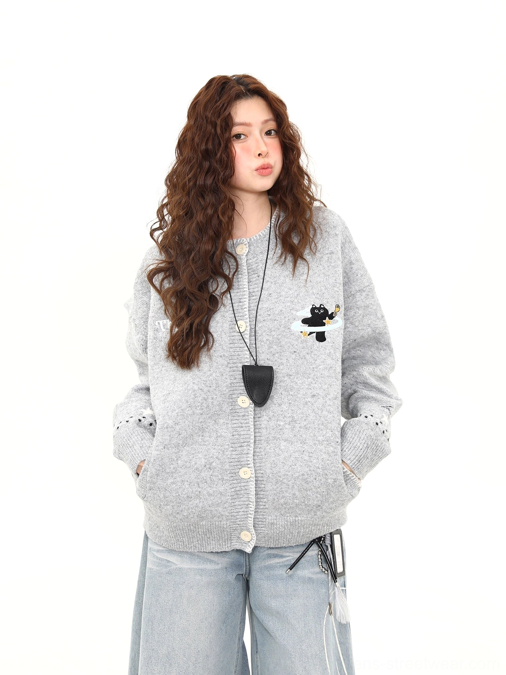 Close front view of a heather grey Moonlight Kitty embroidered knit cardigan with black cat flying saucer motif and eyelet sleeve cuff details
