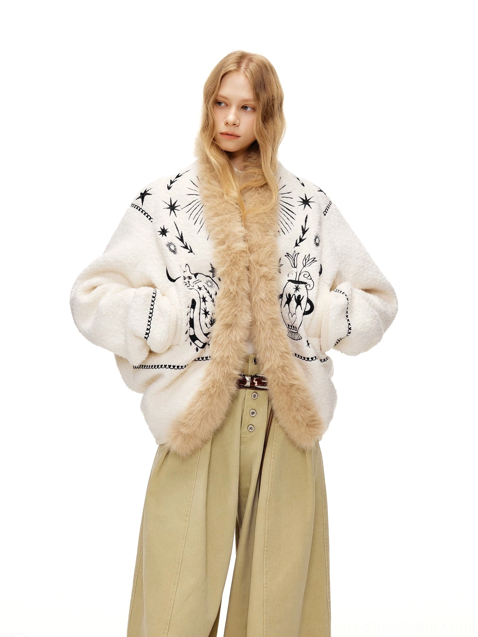 Moonlight white tarot embroidered fleece jacket with faux fur collar shown from the front on a model wearing khaki wide leg trousers