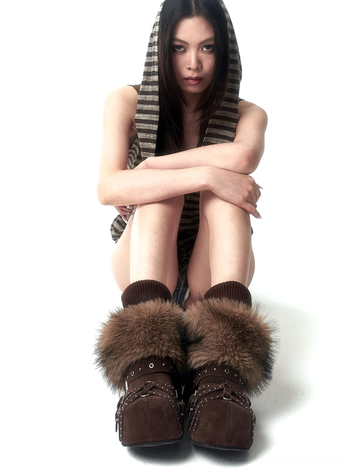 Multi-buckle studded closed-toe mules showcasing a bold platform silhouette and industrial-inspired streetwear hardware