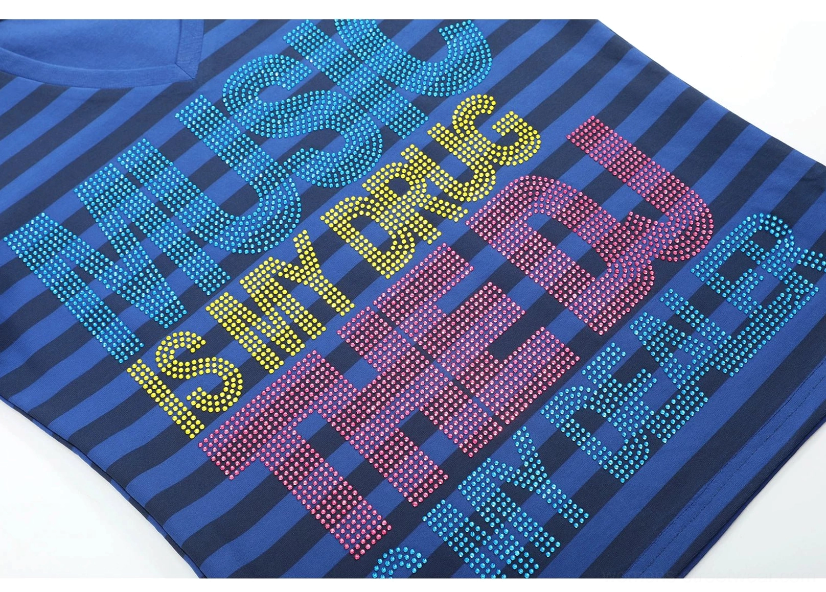 Close-up of multicolor rhinestone Music Is My Drug The DJ Is My Dealer slogan graphic