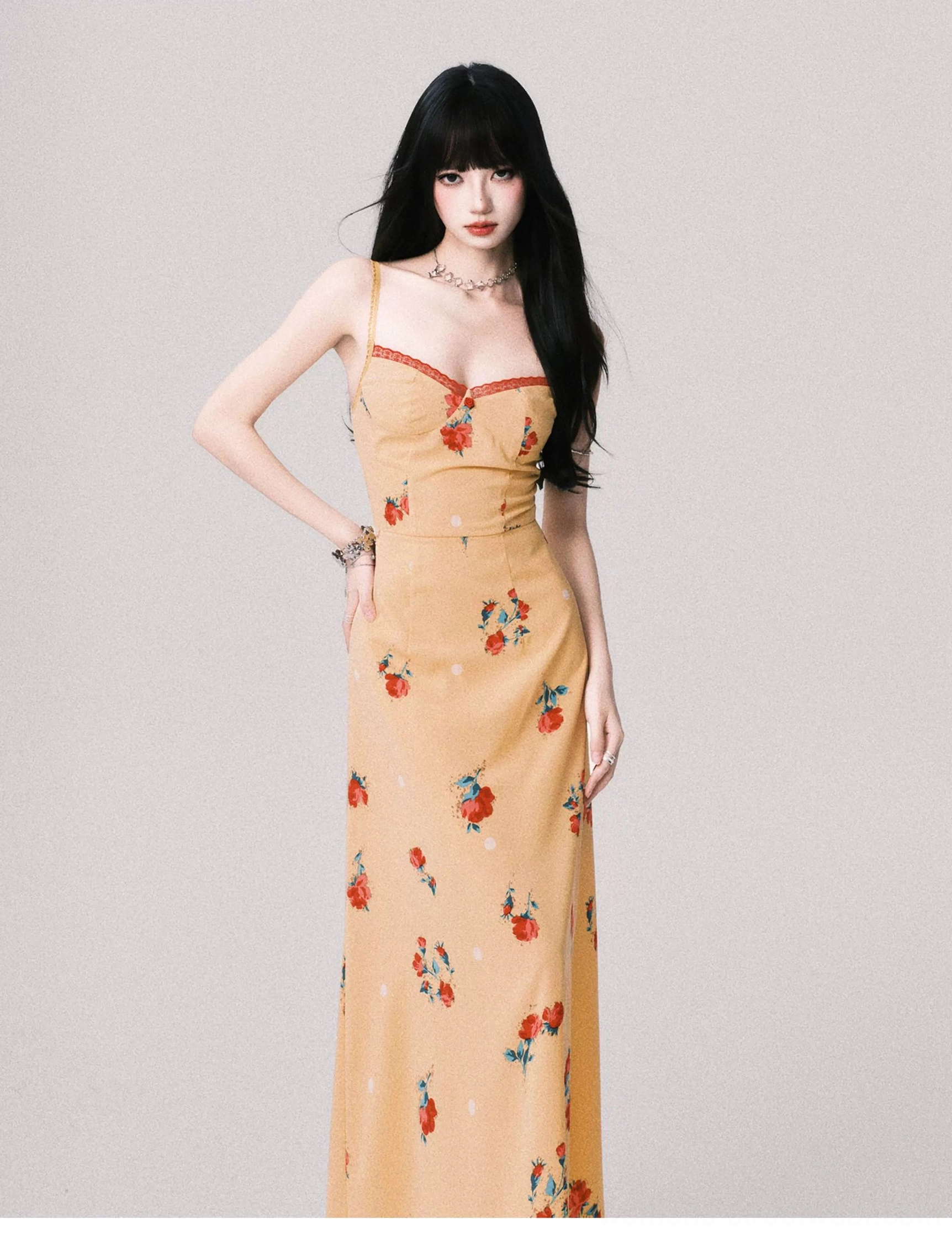 Mustard floral camisole maxi dress shown from the left side with adjustable spaghetti straps and fitted bodice