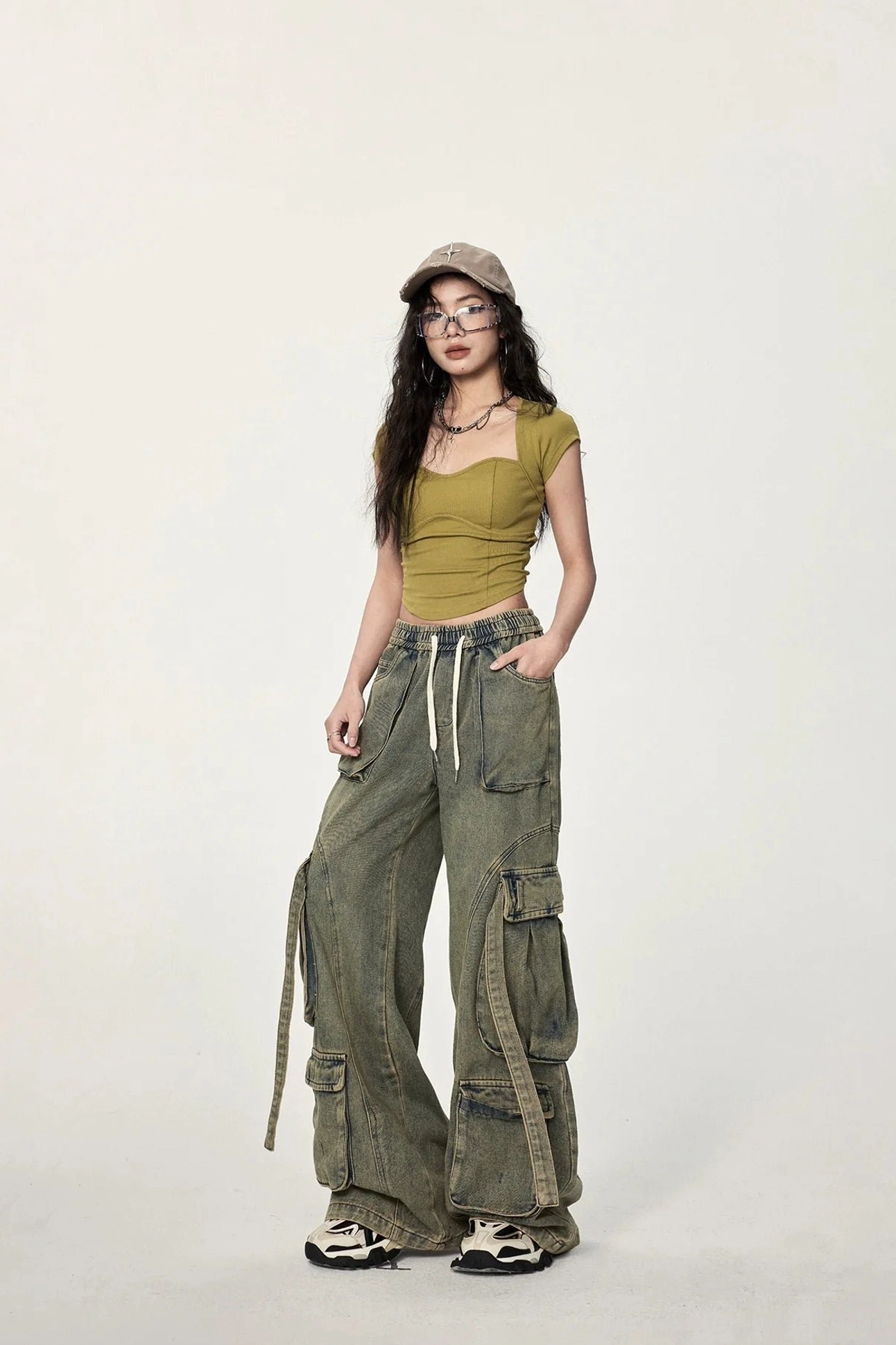 Mustard yellow cropped streetwear tee with twisted open back, slim fit, waist-baring hem, and retro Y2K fashion influence