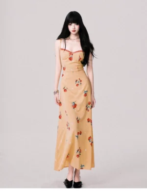 Mustard yellow floral maxi dress with slim silhouette floor length skirt and delicate camisole straps styled with black bow flats