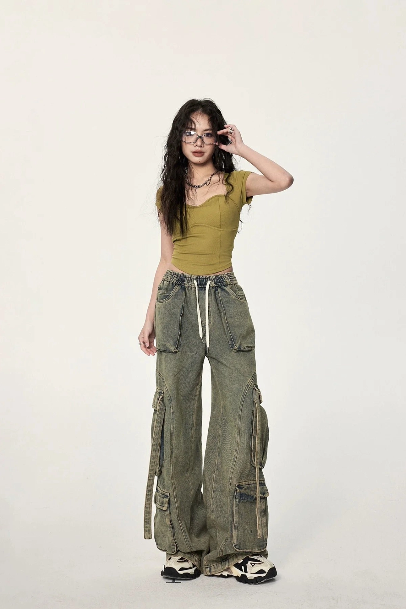 Mustard yellow open back ribbed crop top for women with fitted silhouette, cropped hem, and expressive contemporary streetwear aesthetic