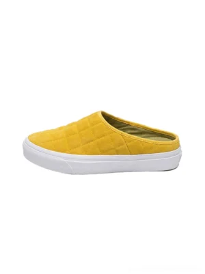 Mustard yellow quilted slip-on sneaker mule side view with padded diamond upper and white rubber sole