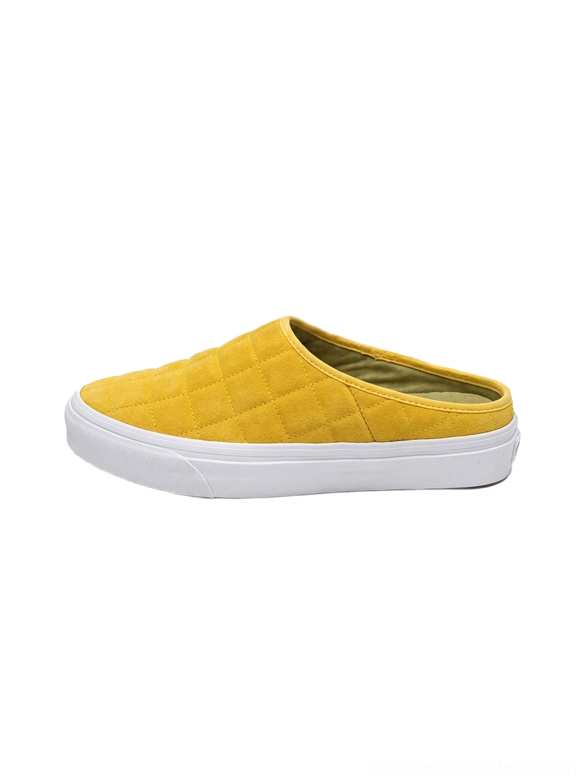 Mustard yellow quilted slip-on sneaker mule side view with padded diamond upper and white rubber sole