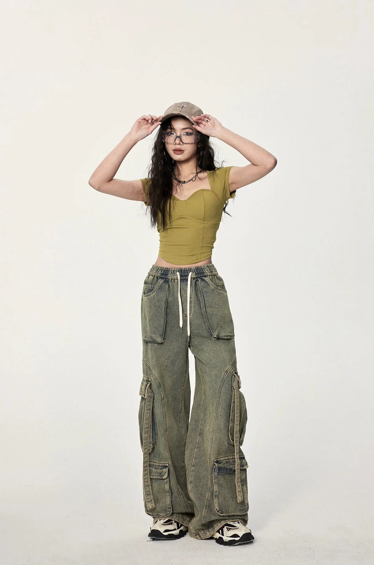 Mustard yellow ribbed twist back crop top designed for women with a fitted silhouette, cropped length, and modern streetwear styling