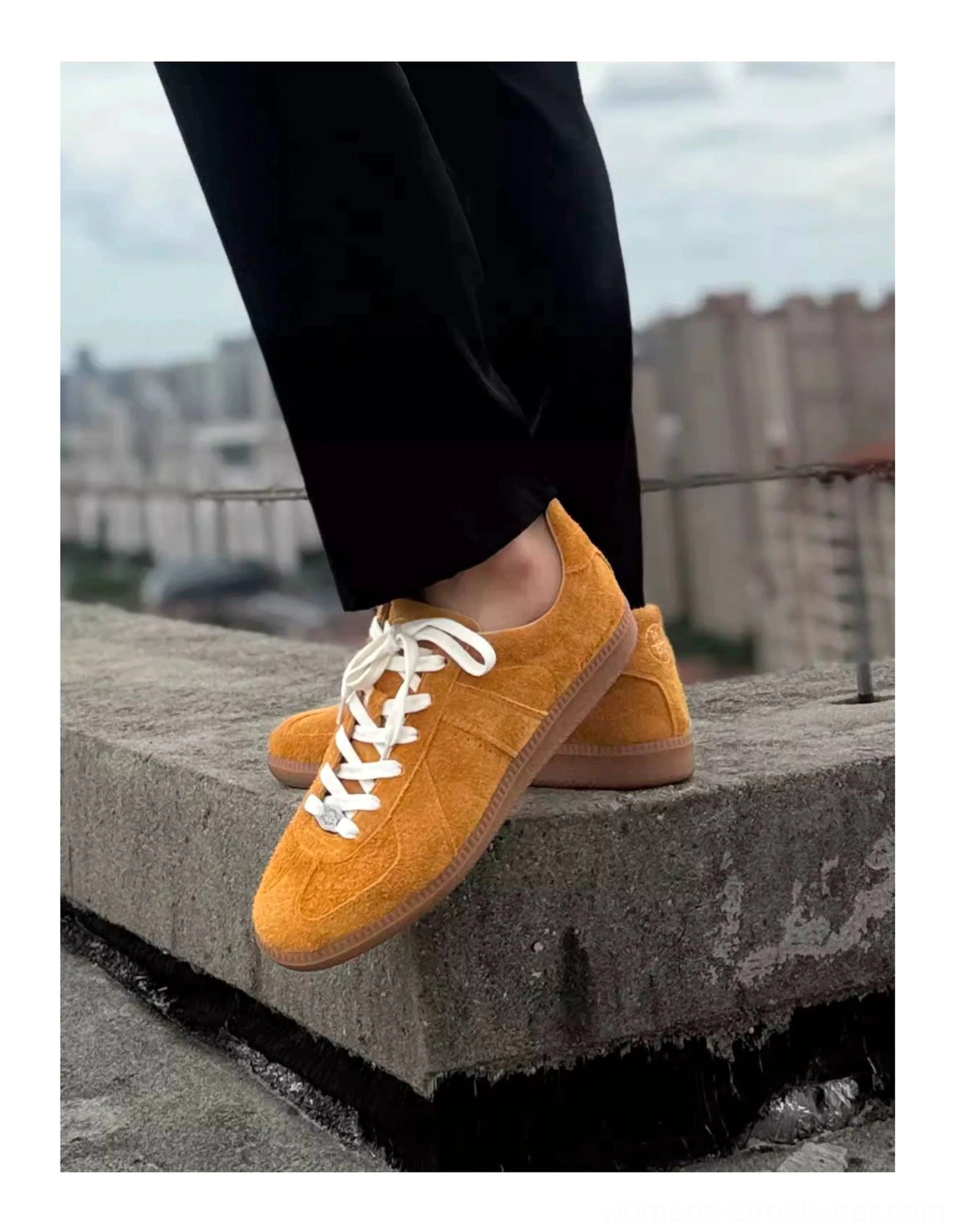 Close-up side view of mustard yellow suede heritage sneakers showing textured leather upper, white laces, and durable gum outsole