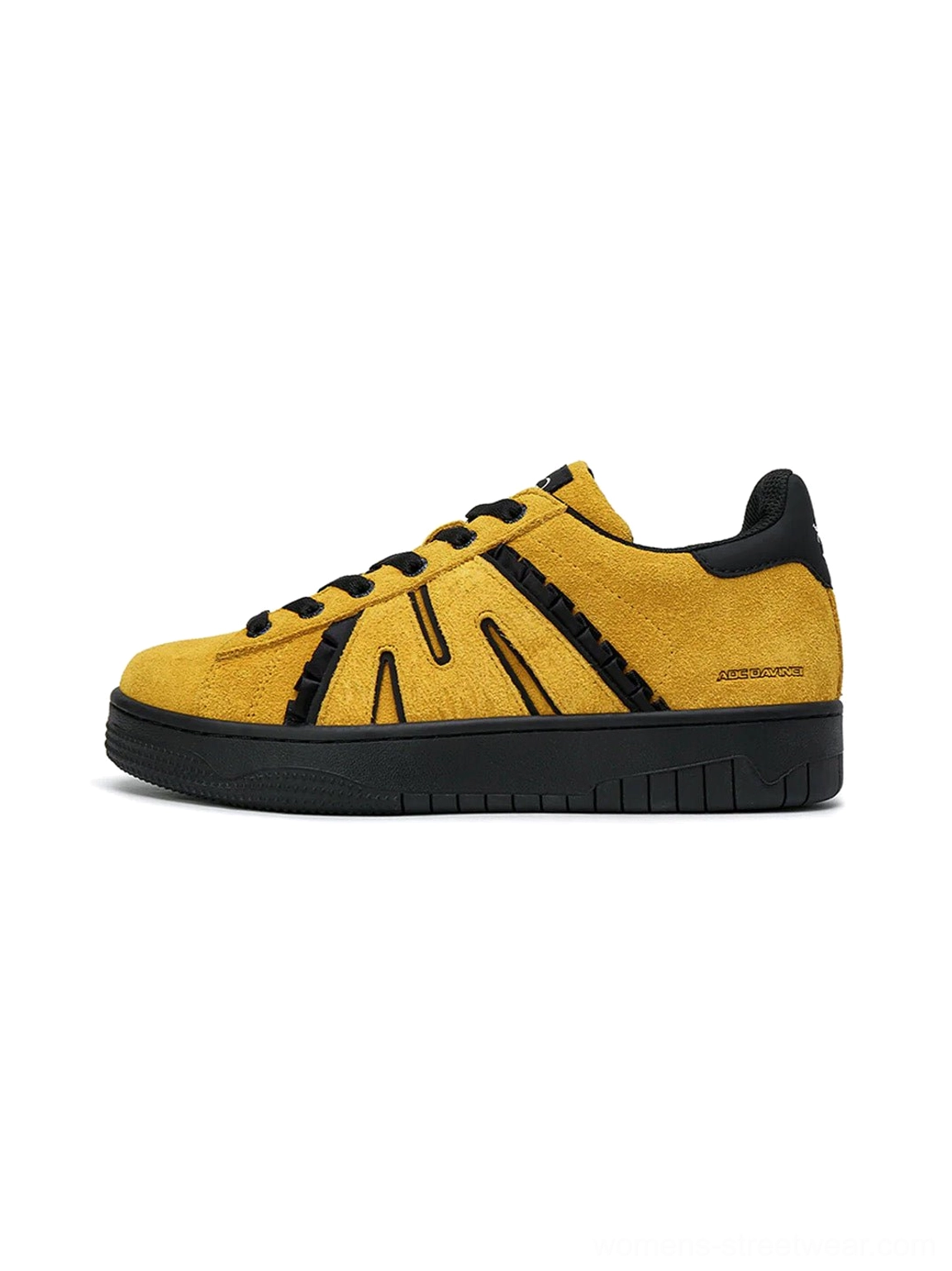 Mustard yellow suede platform skate sneakers with black side stripes and chunky black rubber sole side view