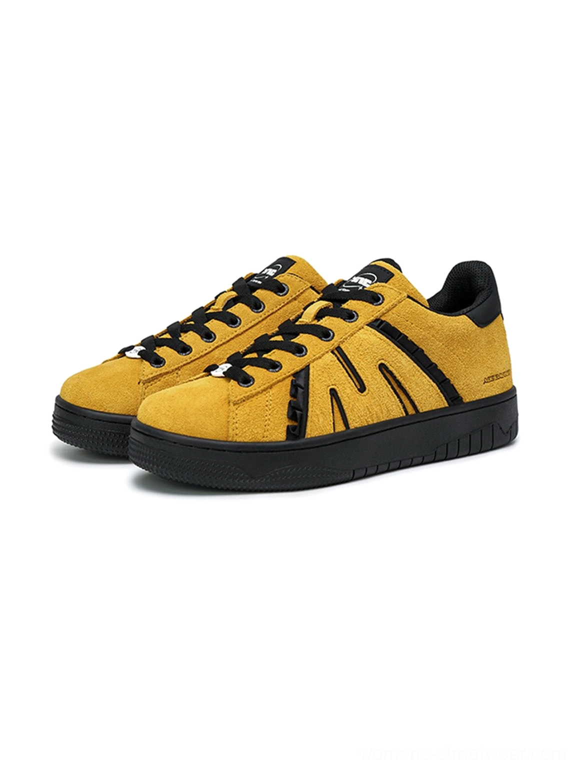 Pair of mustard yellow suede platform skate sneakers with black accents and durable chunky rubber cup soles
