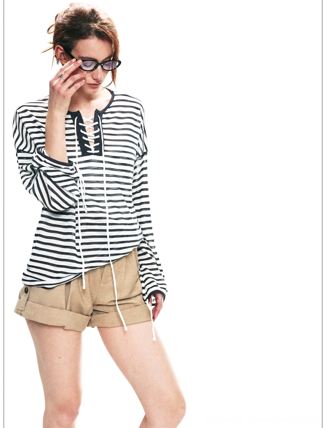 Dark gray white nautical striped lace-up top with relaxed long sleeves and khaki shorts front three-quarter view