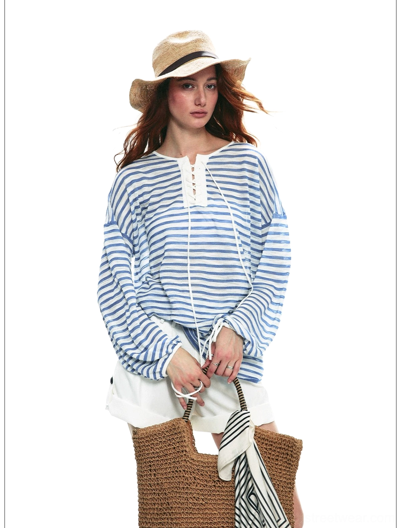 Front view of sky blue and white lace-up striped long sleeve nautical top in relaxed loose fit