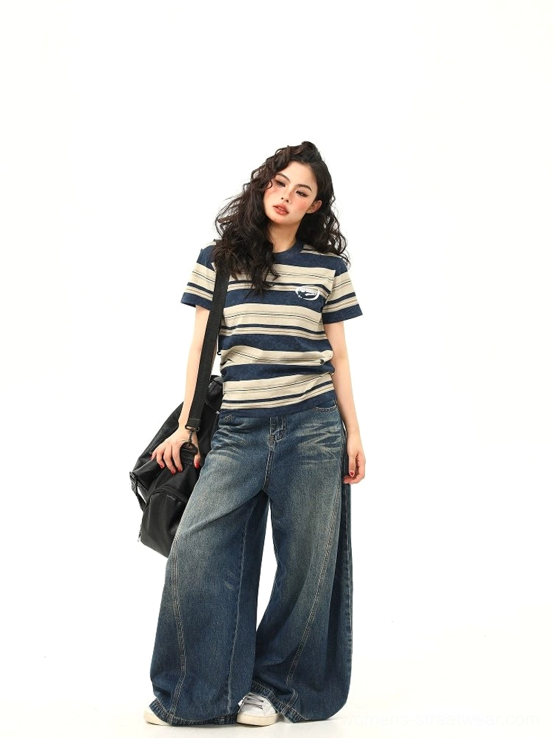 Side front view of women’s vintage navy beige stripe cotton T-shirt with chest logo and relaxed casual fit