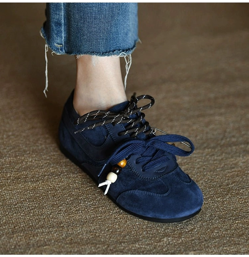 Navy blue beaded suede retro streetwear sneaker showcasing its relaxed low-top silhouette and decorative lace details