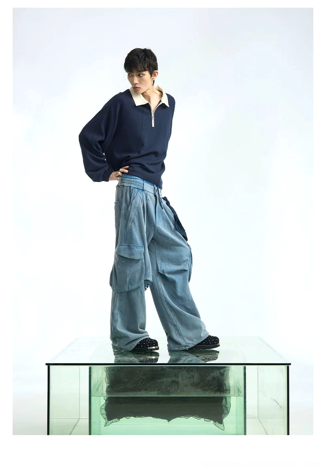 Navy blue half-zip raglan polo pullover with off-white collar shown in a relaxed oversized Korean streetwear fit