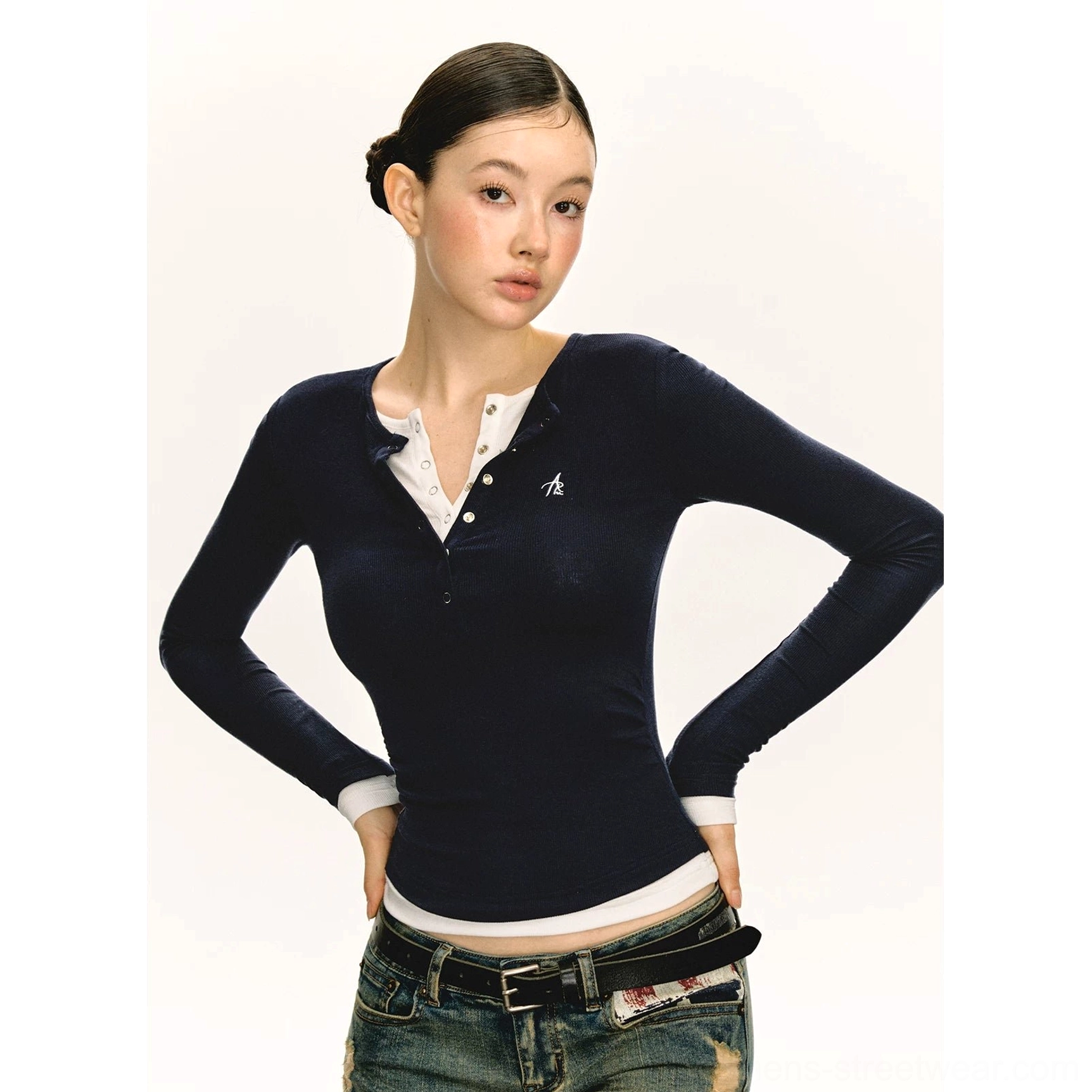 Classic navy blue layered Henley long sleeve streetwear top with snap-button placket styled with distressed denim jeans