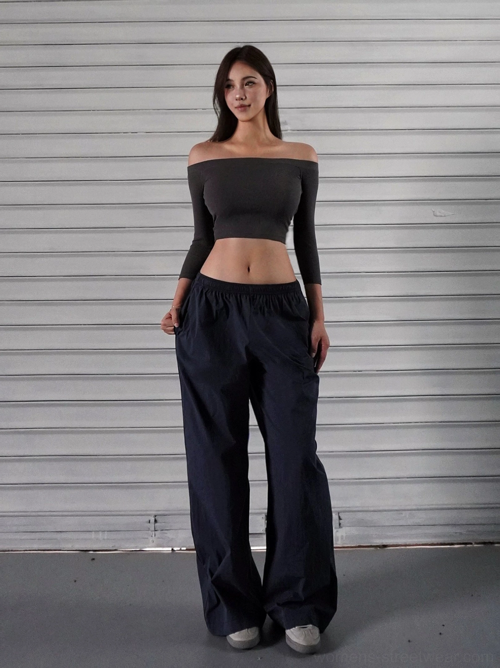 Navy blue low-rise wide-leg cargo pants paired with an off-shoulder cropped top for a Seoul streetwear outfit