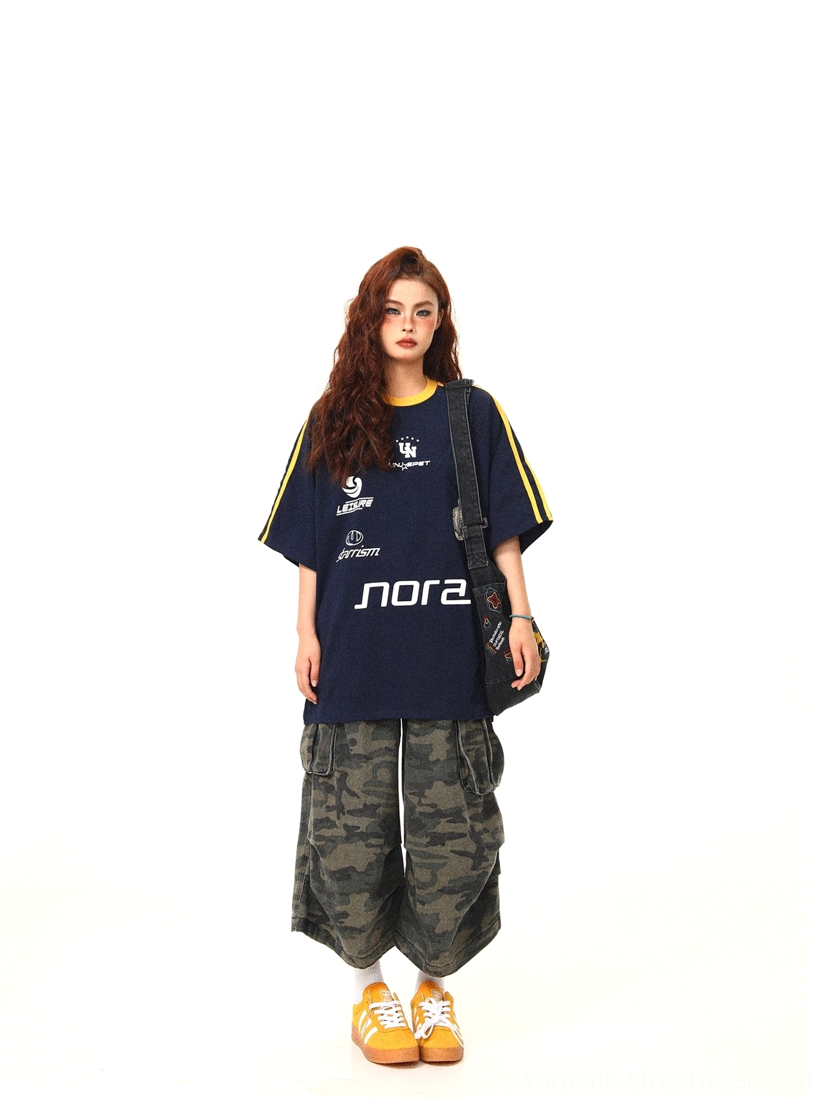Navy blue oversized athletic graphic tee front full body view with yellow contrast collar and sleeve trims