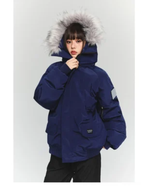 Navy blue oversized faux fur hooded winter parka jacket with multiple utility pockets and sleeve patch in Korean streetwear style
