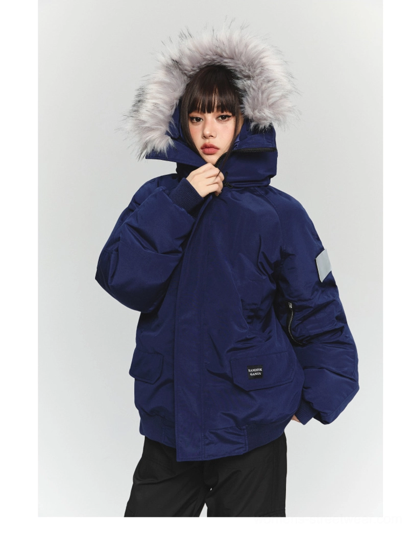 Navy blue oversized faux fur hooded winter parka jacket with multiple utility pockets and sleeve patch in Korean streetwear style