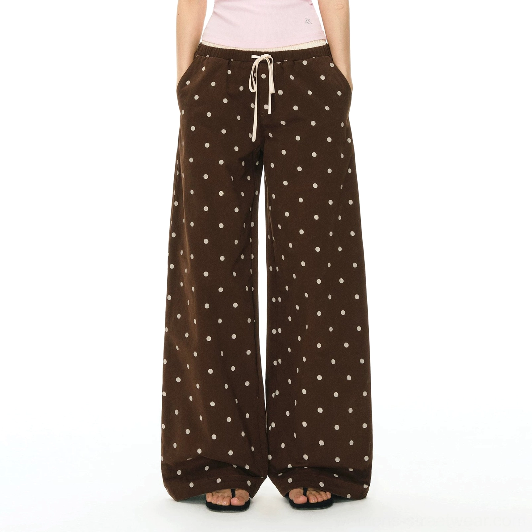 Navy blue polka dot drawstring wide leg pants styled with a white top and black slide sandals in a relaxed Korean streetwear look