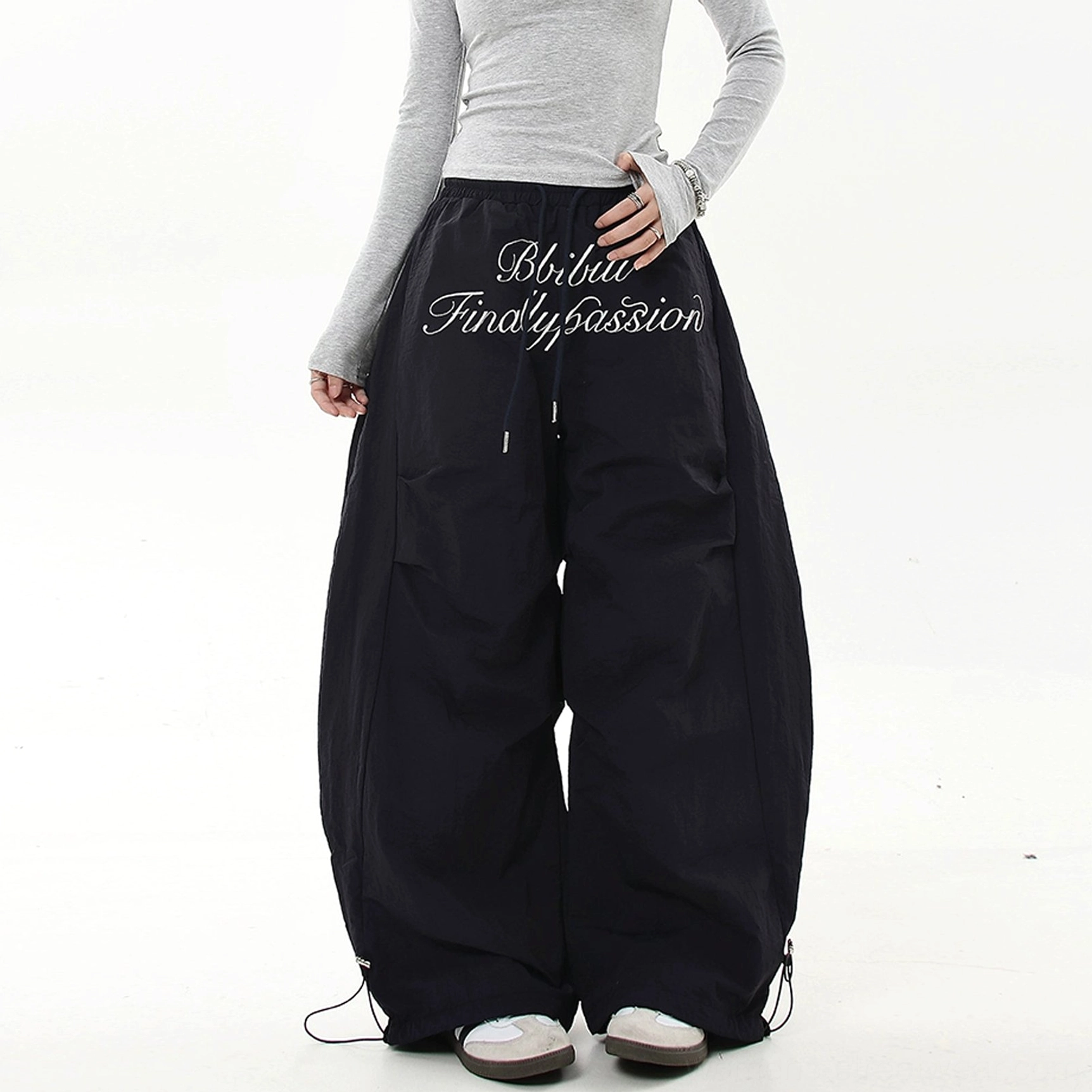 Navy blue Scripted Devotion parachute streetwear cargo pants with oversized wide legs, adjustable waistband and drawstring ankle cuffs