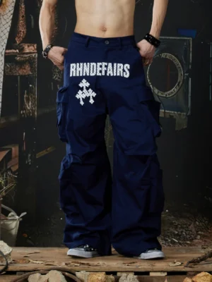 Navy blue stacked pocket wide-leg streetwear cargo pants front view showing contrast graphic waist detail and baggy fit