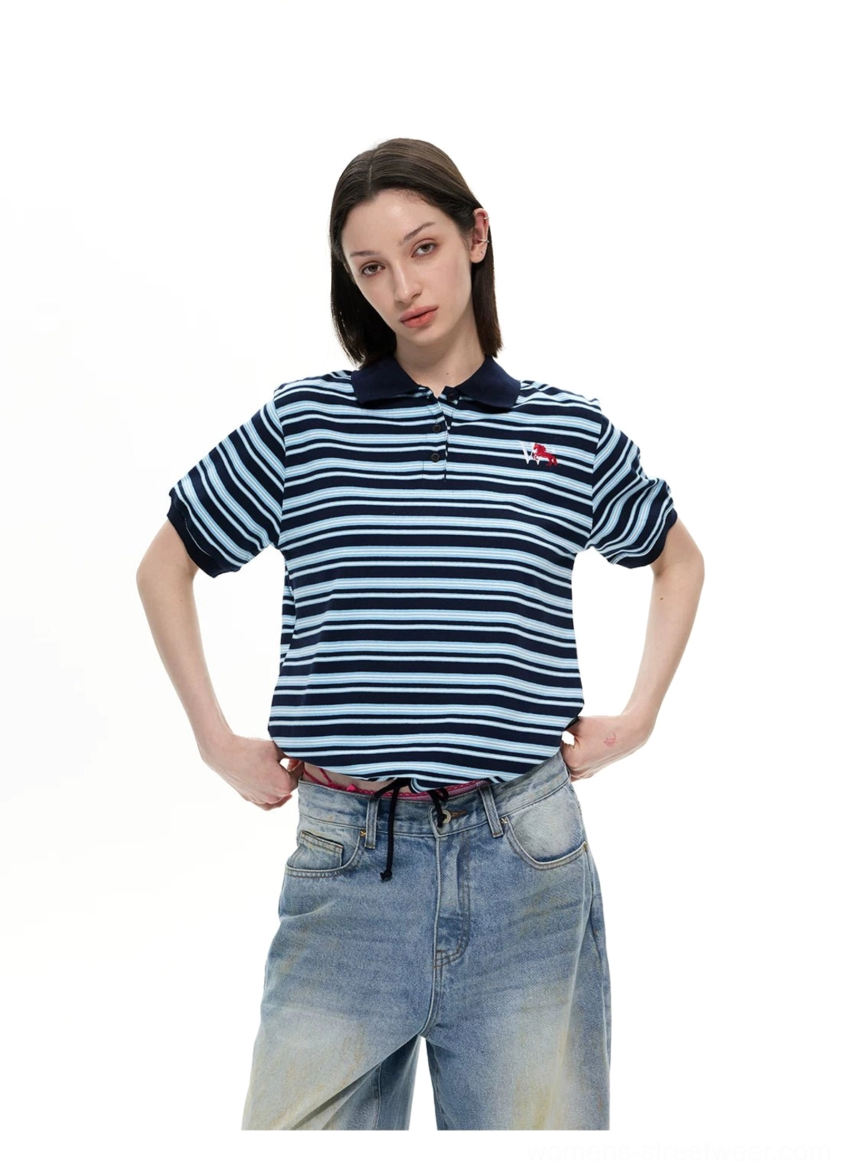Navy blue striped retro polo shirt paired with drawstring waist wide leg denim jeans front view