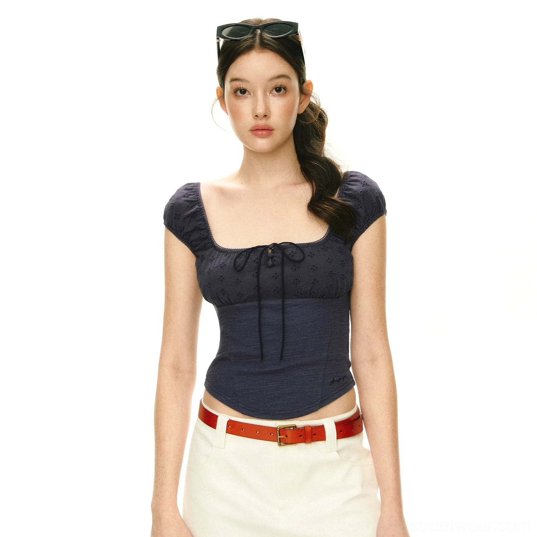 Navy blue textured square neck puff sleeve corset-inspired crop top with front tie front view