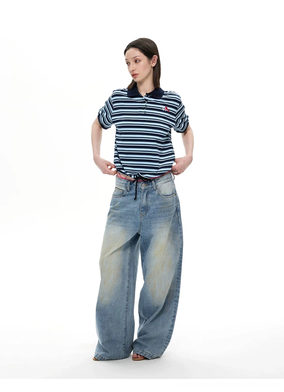 Navy and light blue striped polo shirt with small red embroidered chest motif and contrast cuffs