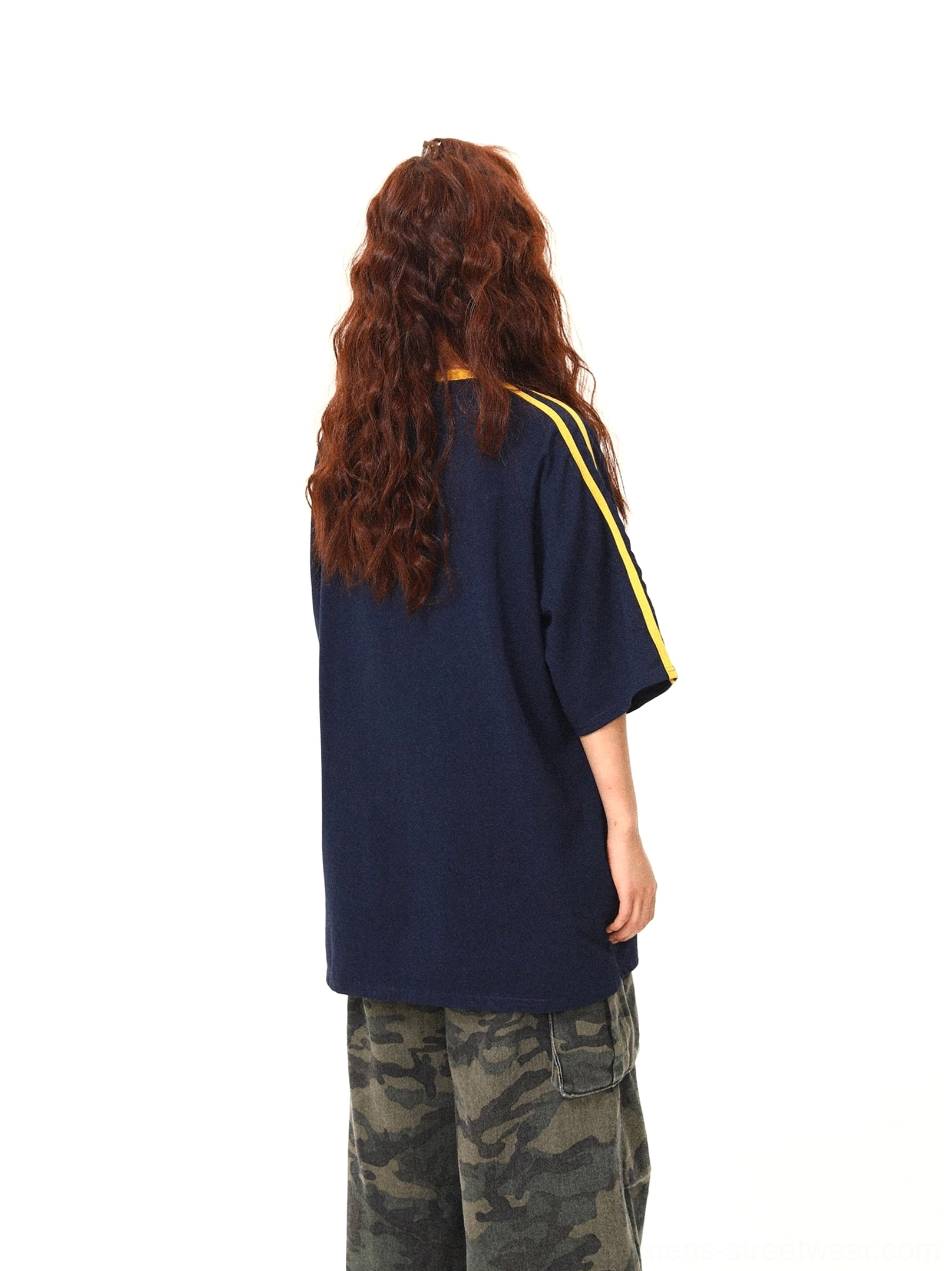 Back view of navy oversized sporty streetwear t-shirt with clean solid navy panel and yellow sleeve stripe trims