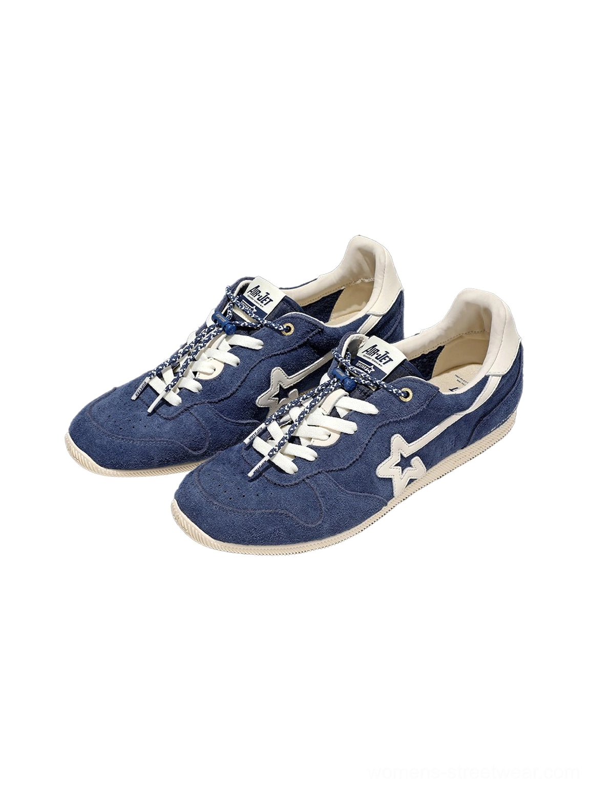 Pair of navy blue low-profile retro suede sneakers with star-inspired side details, patterned laces, and off-white soles