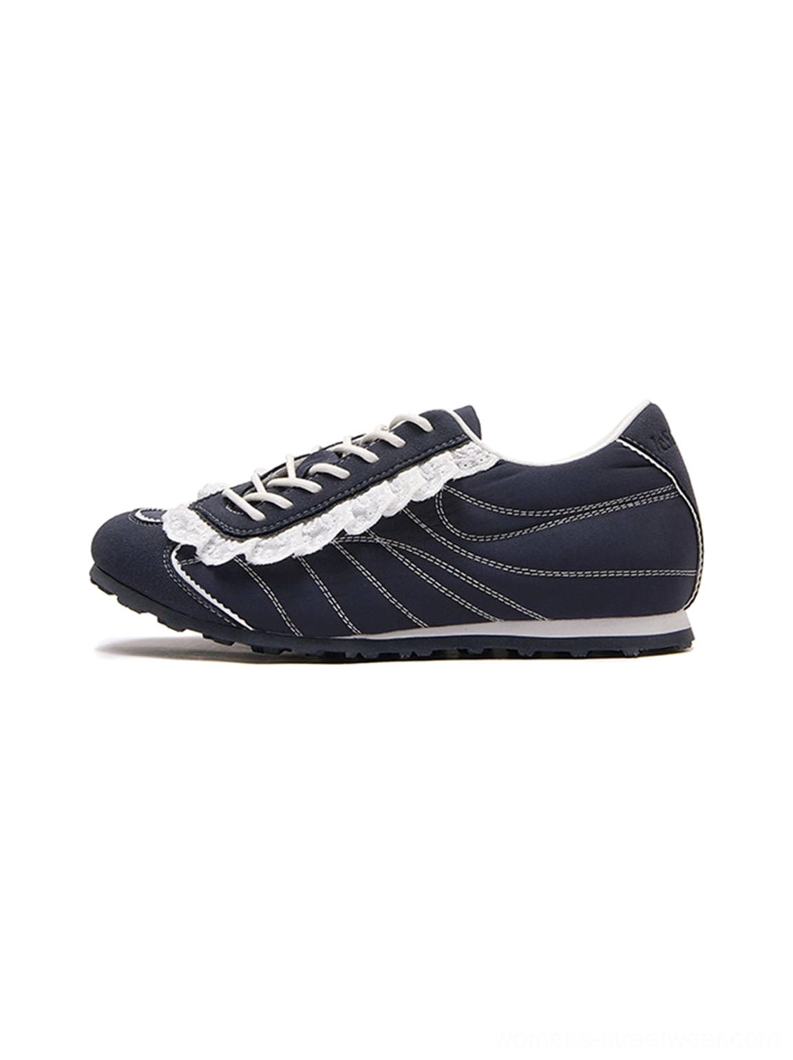 Dark navy low-profile streetwear trainer in side profile with white contrast stitching and decorative ruffled lace trim