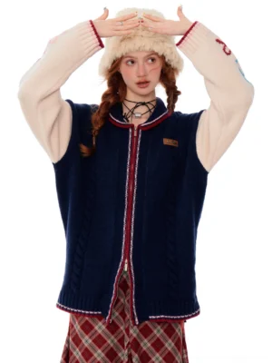Female model wearing a navy varsity zip cardigan with contrast sleeves and red trim in a relaxed Korean streetwear outfit