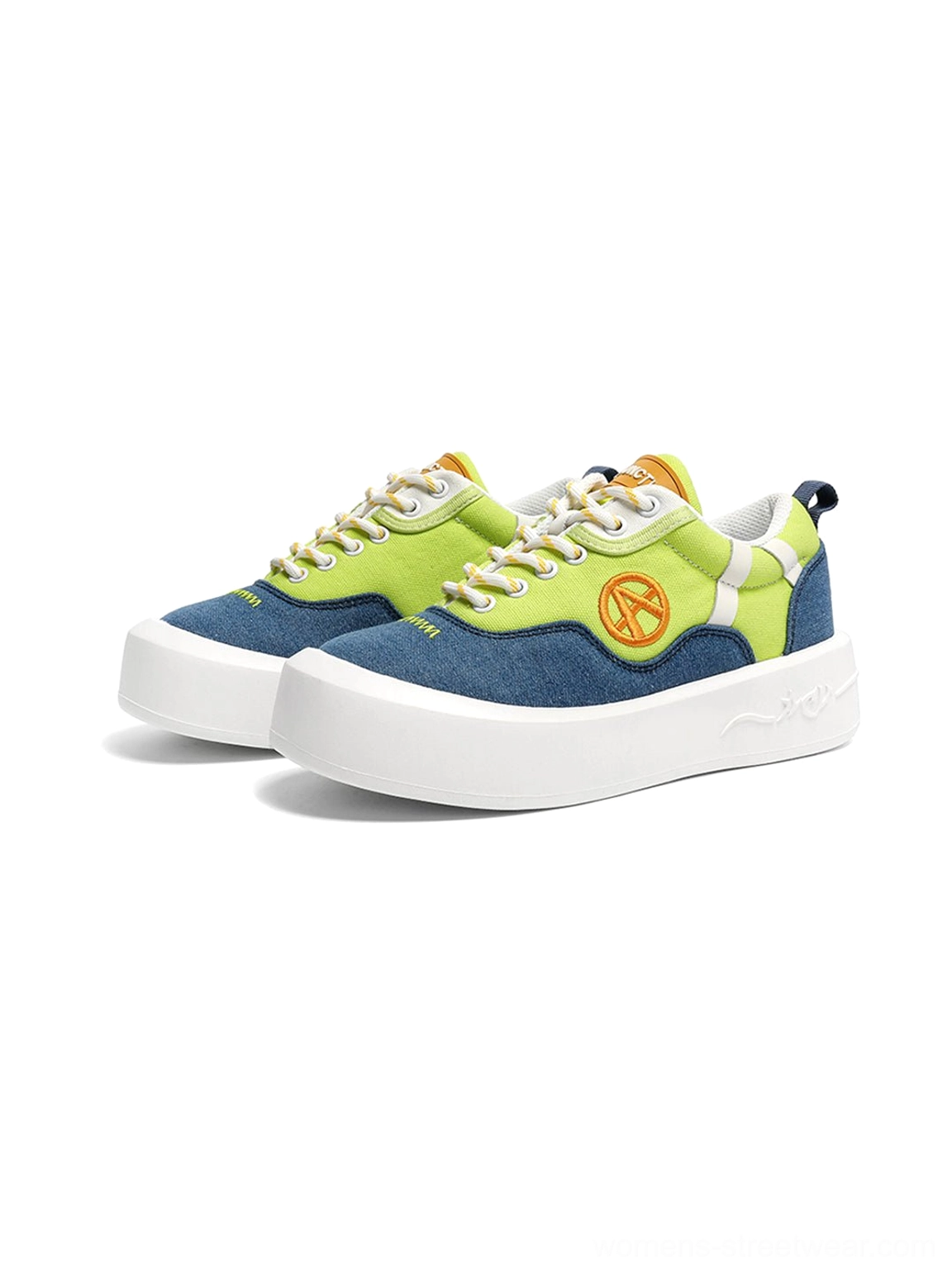 Front view of a pair of neon colorblock canvas platform sneakers with matching bright panels and white soles
