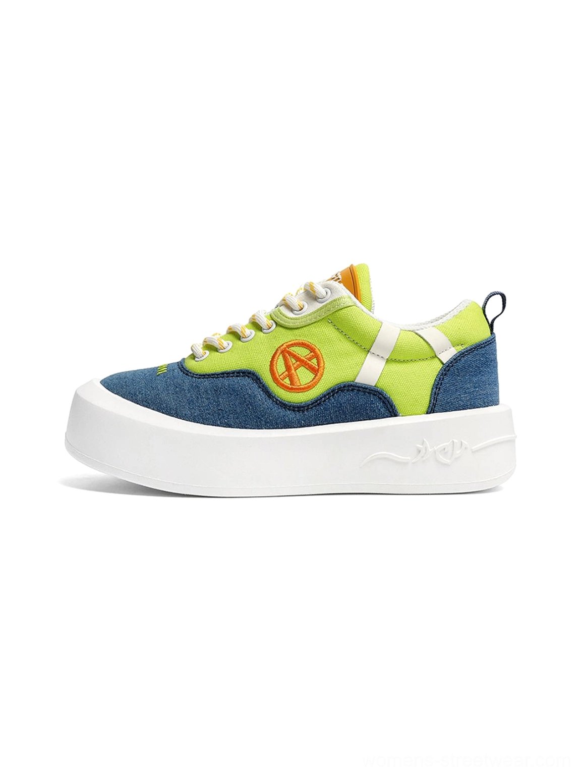 Neon colorblock canvas platform sneakers in green blue and white with orange circular side patch and chunky wavy sole