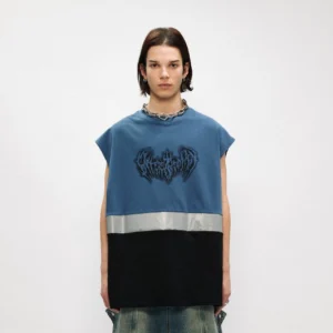 Male model wearing a dusty blue and black oversized gothic graphic tank top with reflective stripe and loose jeans