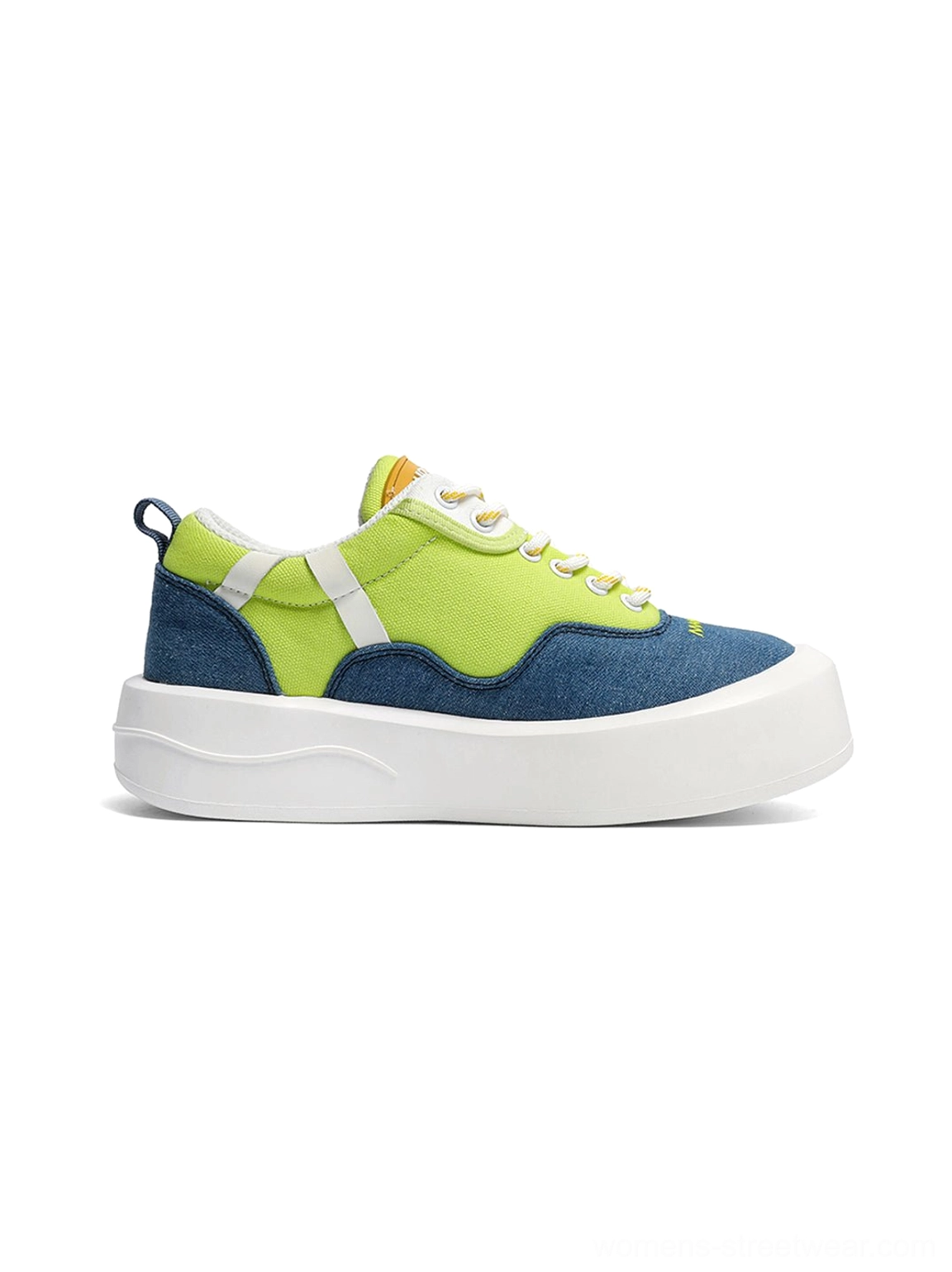 Side profile of neon colorblock platform sneaker highlighting the orange circular patch wavy midsole and canvas upper