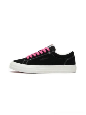Black suede platform canvas sneakers with bright neon pink laces, white thick rubber outsole, low-top streetwear silhouette, and clean side profile