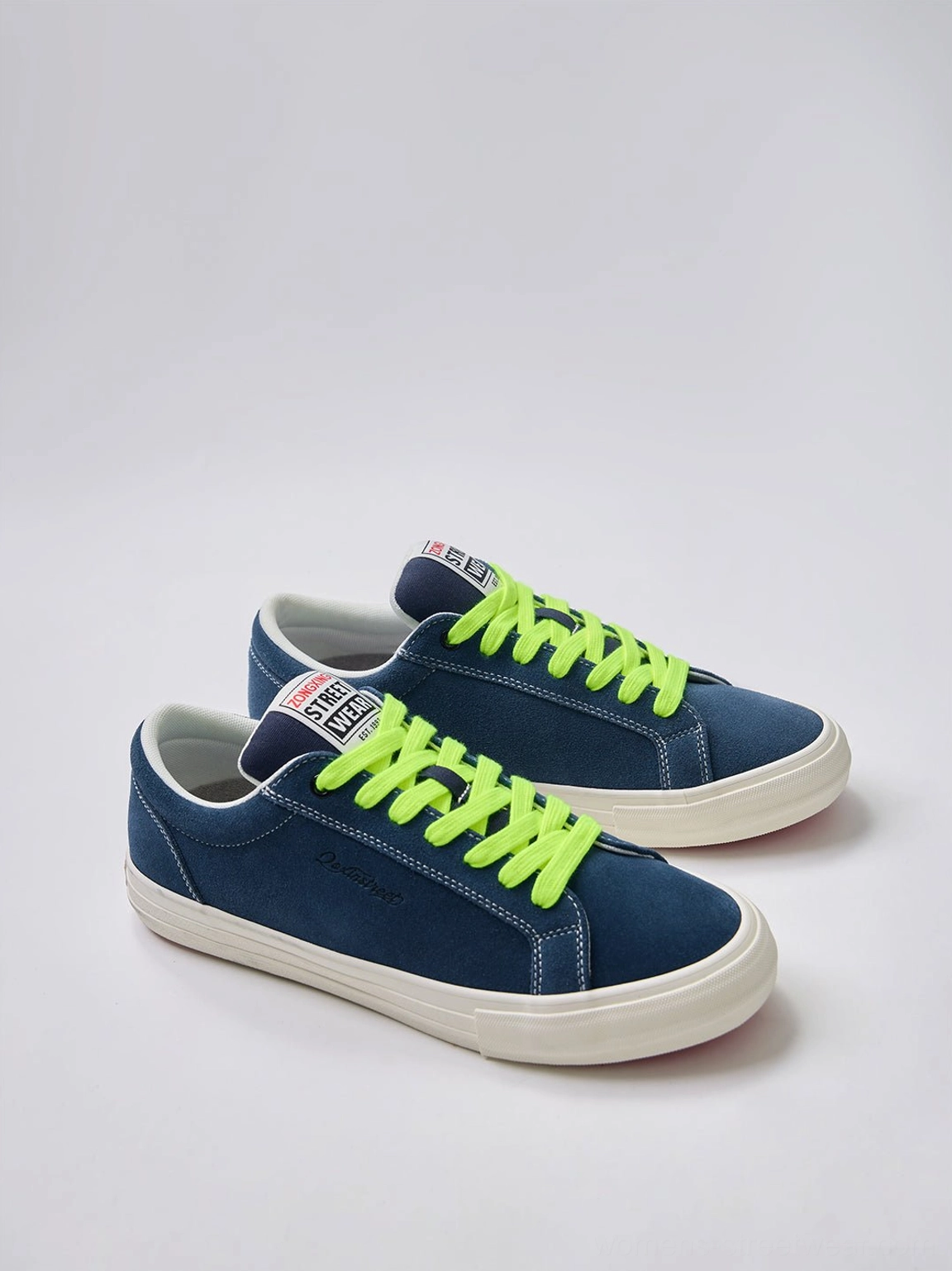 Close-up view of neon lace suede platform canvas sneakers designed for Y2K fashion, Korean streetwear, and casual outfits