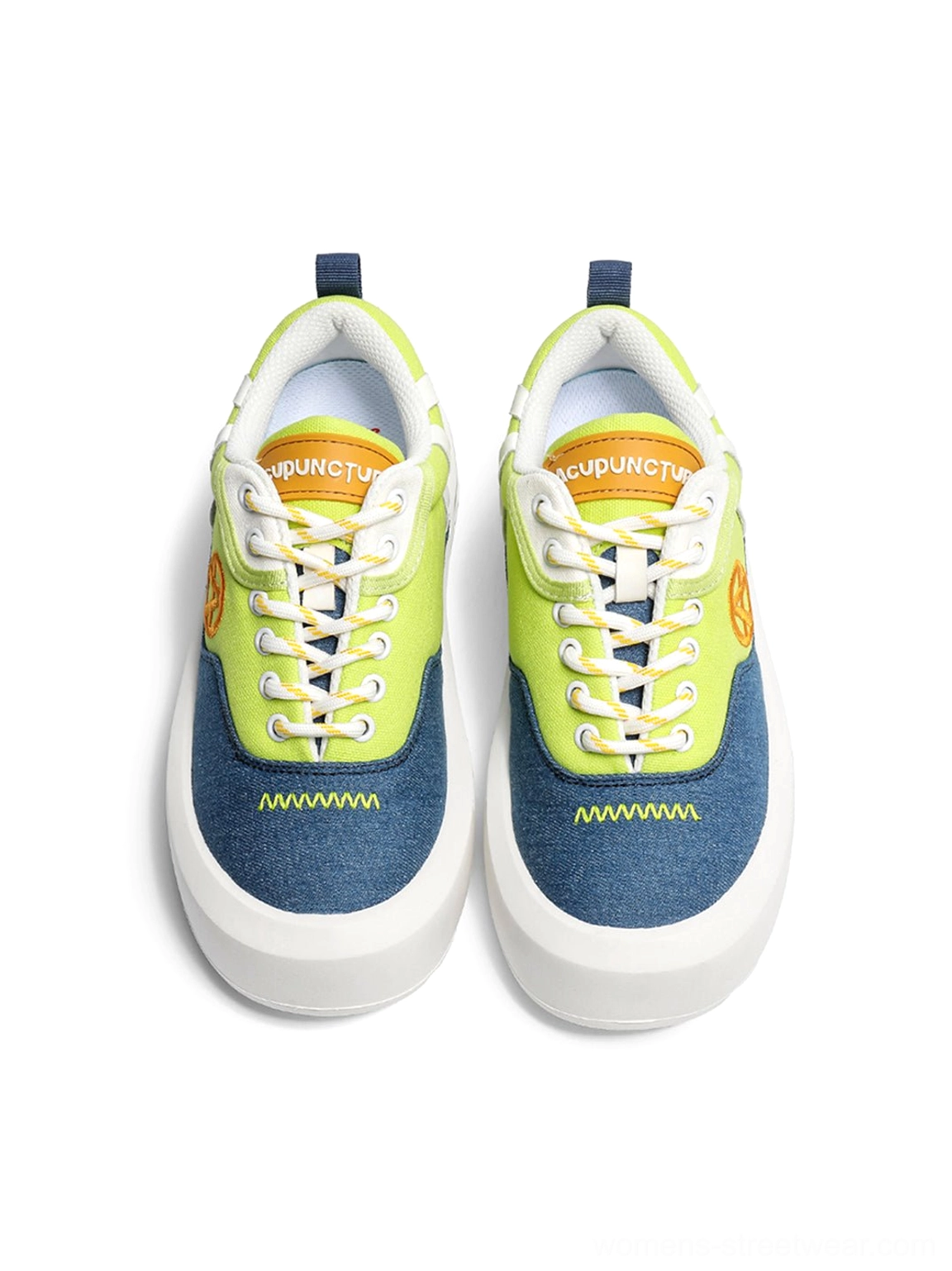 Top-down flat lay of neon platform sneakers with yellow laces graphic insole and wavy toe cap stitching