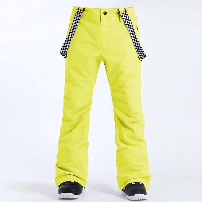 Neon yellow insulated snow pants with black and white checkerboard shoulder straps for bold Y2K ski streetwear styling