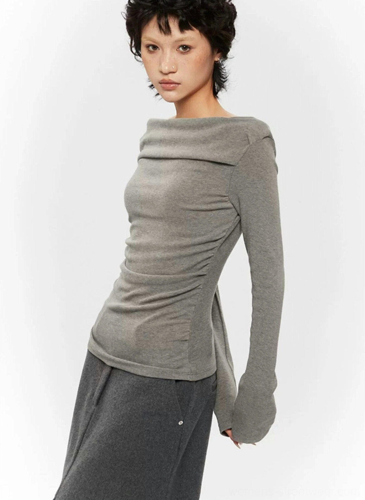 Off-shoulder ruched long-sleeve top in a neutral streetwear color with fitted silhouette and draped neckline