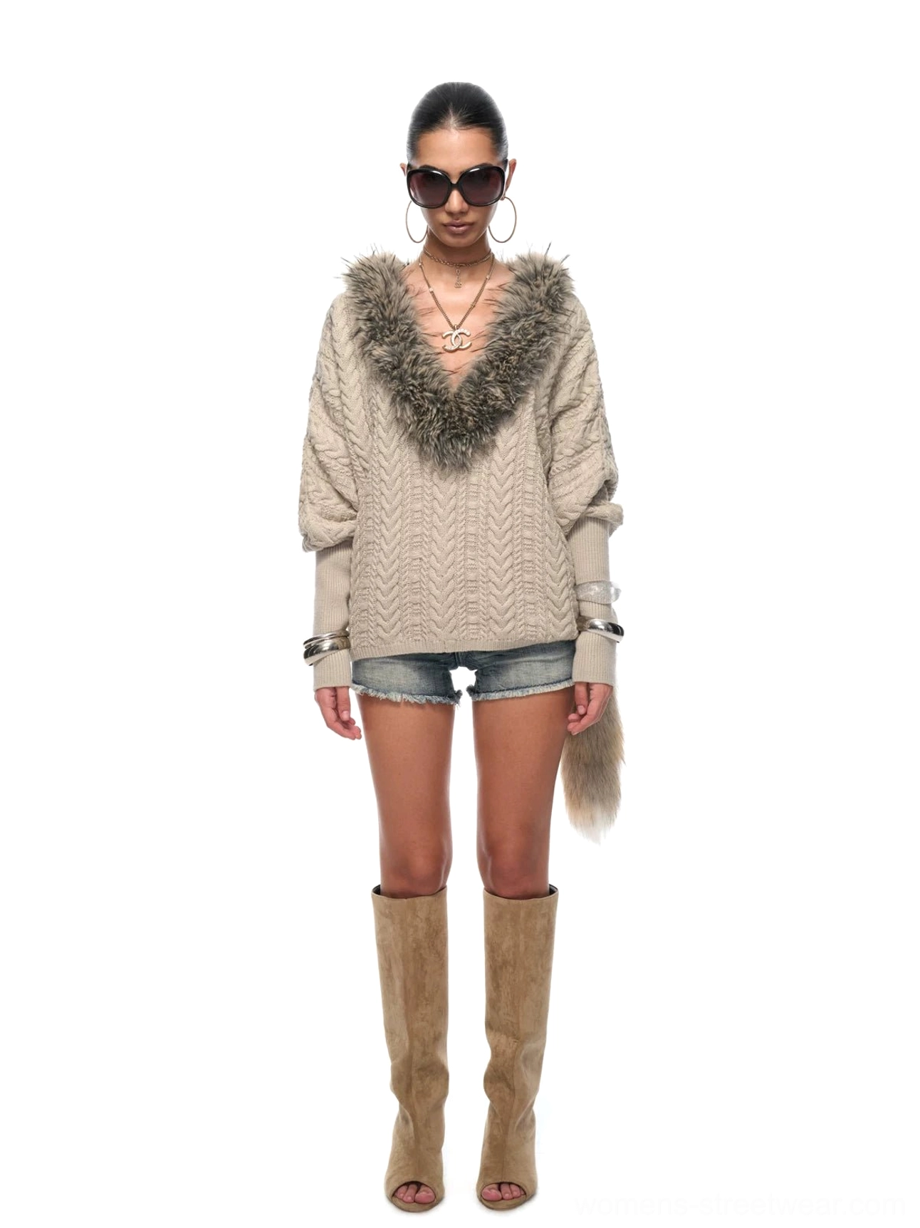 Full front view of a neutral silver gray oversized cable knit sweater with plush faux fur collar and neat ribbed cuffs