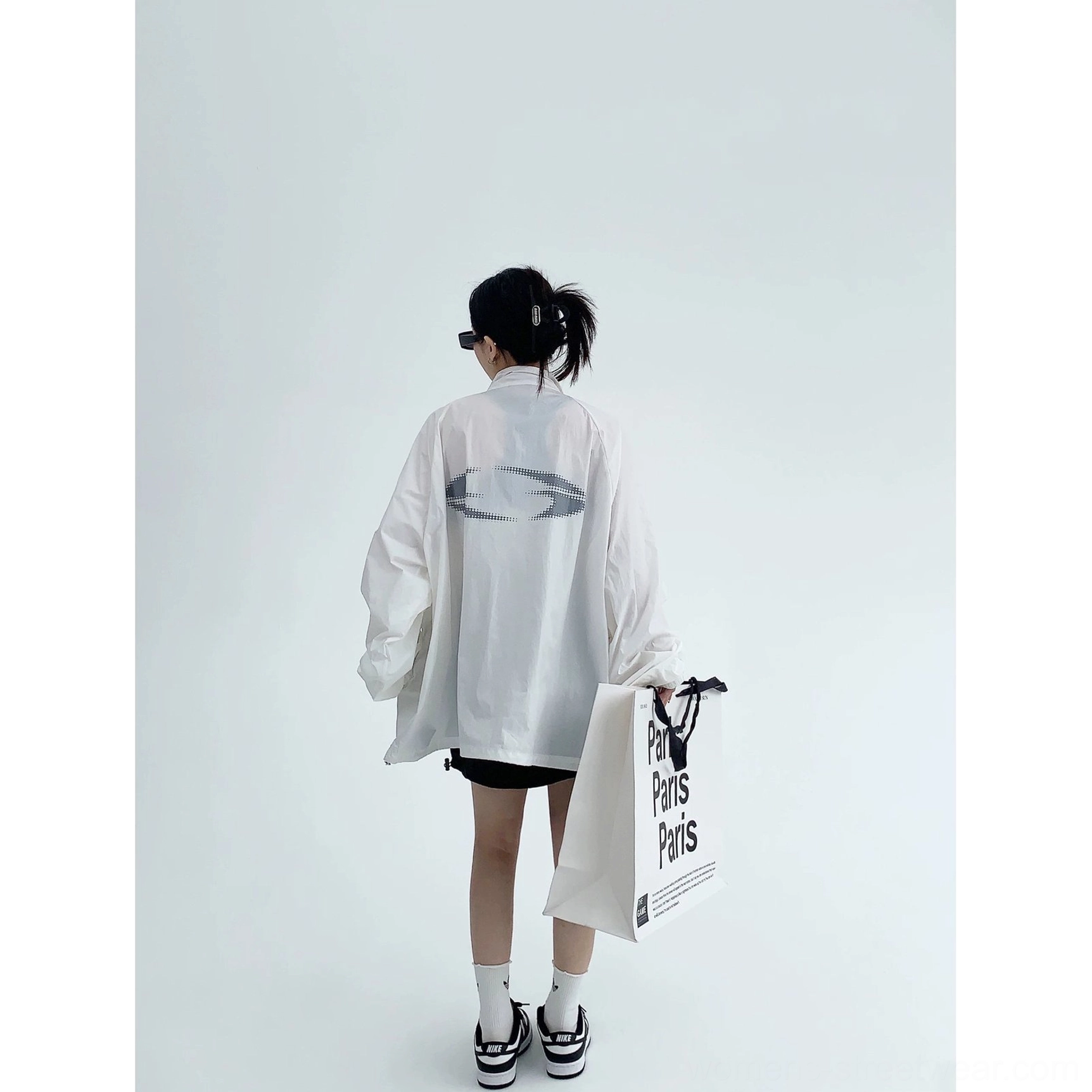 Gray and neutral streetwear windbreaker jacket product image featuring oversized fit, breathable fabric, full zip closure, and subtle logo detailing