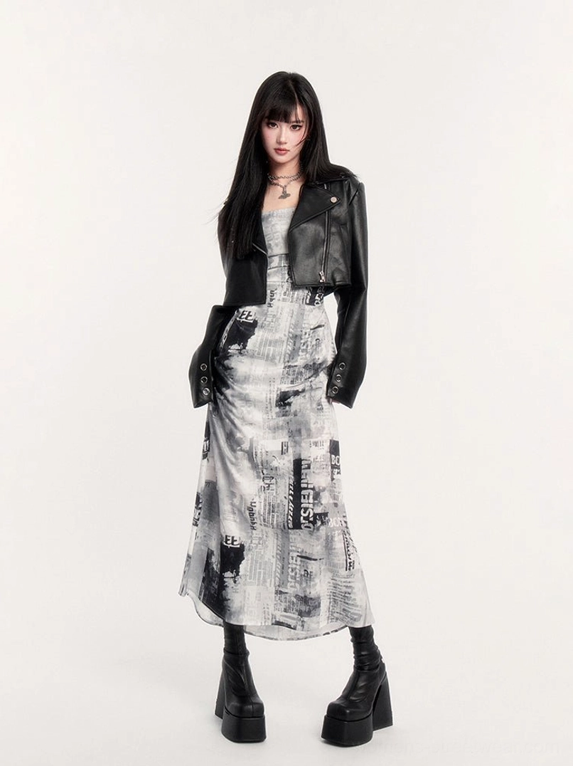 Monochrome newspaper print slip maxi dress styled with cropped black leather biker jacket for punk streetwear outfit