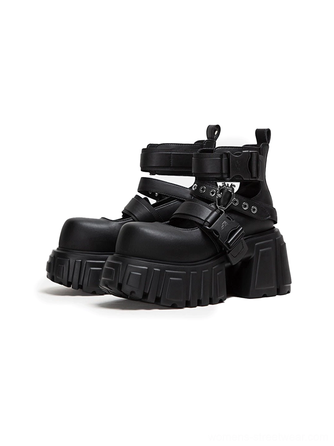 Pair of black buckled platform boots with adjustable side straps, metal hardware, chunky lug soles, and alternative streetwear design