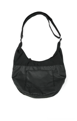 Matte black utility sling hobo crossbody bag front view with crescent shape front pocket adjustable metal buckle strap and snap closure